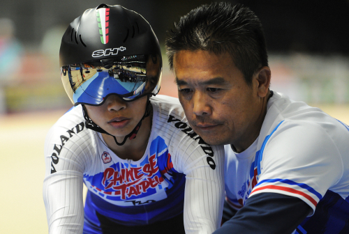 A cyclist with their coach
